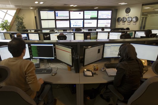 technicians-monitor-data-flow-in-the-control-room-of-an-internet-servi